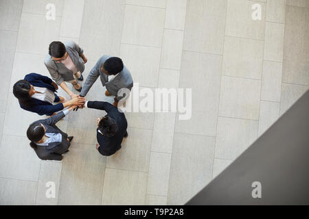 Business team stacking hands together Stock Photo