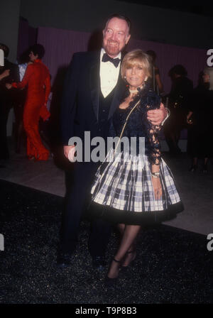 Westwood, California, USA 19th April 1994  Director Jack Haley Jr. and singer Nancy Sinatra attend 70th Birthday Party for Henry Mancini on April 19, 1994 at Pauley Pavilion at UCLA in Westwood, California, USA. Photo by Barry King/Alamy Stock Photo Stock Photo