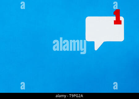 Paper speech bubble concept on blue background. Social Media Chat concept. Stock Photo