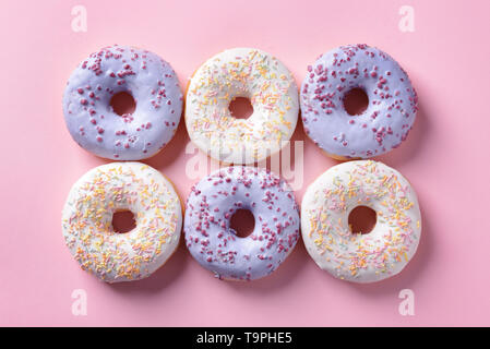 Tasty doughnuts on color background Stock Photo