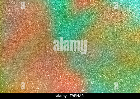 Abstract blurred of green and orange glittering shine bulbs lights background. Blur of Christmas wallpaper decorations concept. Multicolored glitter b Stock Photo