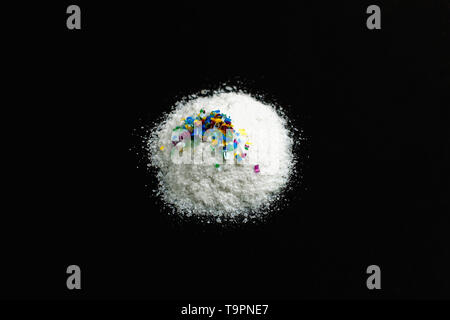 Microplastic Salt Microplastic particles in salt on black background. Water pollution ...