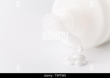 White plastic cosmetic foam pump bottle Stock Photo
