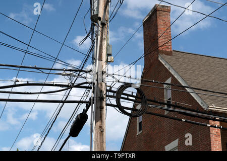 many electric cables on old maryland houses Stock Photo