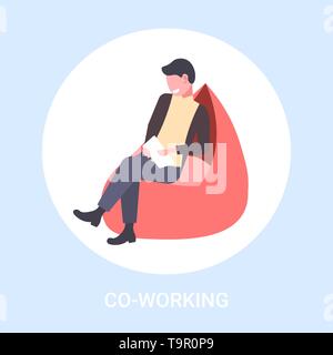 businessman freelancer sitting at armchair business man using tablet freelance co-working concept male cartoon character concept flat full length Stock Vector