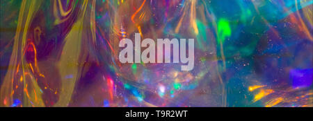 multicolored  holographic iridescent surface wrinkled foil  pastel Stock Photo