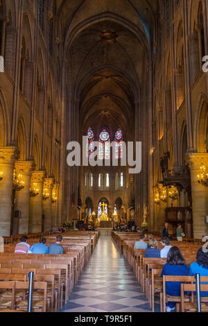 PARIS, FRANCE - People attend morning service in Notre Dame cathedral on April 25, 2011 in Paris, France. Stock Photo