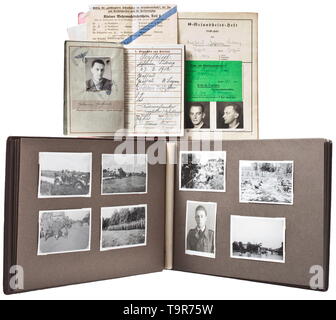 An estate of Rottenführer Johann Seyfried - 5th SS Totenkopf Artillerie (Death's Head Artillery) Wehrpass (military service book) with photograph, issued 25 January 1939 by '5./SS.T.A.R.115'. Entries recording promotions, duty stations (Totenkopf Standarte 'Ostmark' etc.), decoration (medal commemorating the annexation of Austria), battles, killed in action 17 July 1941. SS medical booklet with several photographs, issued 23 May 1939 in Schärding, with numerous entries on the results of the successful medical examination. A photograph album containing 130 pictures taken dur, Editorial-Use-Only Stock Photo