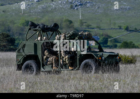 U.S. Army Paratroopers of 1st Battalion, 503rd Parachute Infantry Regiment (Airborne) drive in the Army Ground Mobility Vehicle, the newest vehicle edition to the 173rd Infantry Brigade Combat Team (Airborne), in order to prepare for sling load operations during exercise Immediate Response 19 at Udbina Air Base, Croatia, 17 May 2019. Exercise Immediate Response is a multinational exercise co-led by Croatian Armed Forces, Slovenian Armed Forces and U.S. Army Europe. The logistics-focused exercise is designed to test and improve the ability to move forces and equipment rapidly from one location  Stock Photo