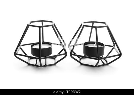 Stylish candle holders on white background Stock Photo - Alamy