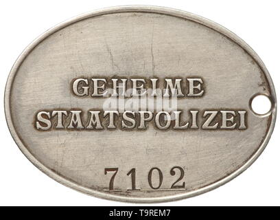 An identification badge '7102' of the GESTAPO Nickel silver. Raised national eagle, the opposite side inscribed in relief 'GEHEIME STAATSPOLIZEI' in typical characters, beneath the struck number '7102'. Dimensions 37 x 51 mm. Very rare. historic, historical, 20th century, Additional-Rights-Clearance-Info-Not-Available Stock Photo