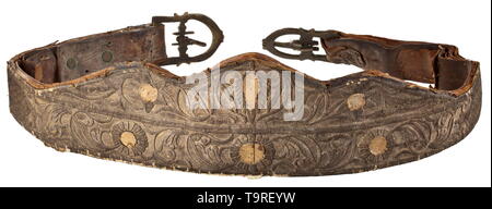 A silver-embroidered North African splendid saddle, 19th century Leather and fur covered wood construction. The leather blanket with raised ornamental embroidery made of silver tinsel cord (over applied cardboard pieces). Including the en suite decorated head harness and tackle with attached buckles and a pair of brass stirrups engraved on the exterior. Silver embroidery darkened and rubbed in the thigh area. A finely crafted saddle clearly improvable through cleaning. Length circa 67 cm. historic, historical, Africa, African, weapon, arms, weapo, Additional-Rights-Clearance-Info-Not-Available