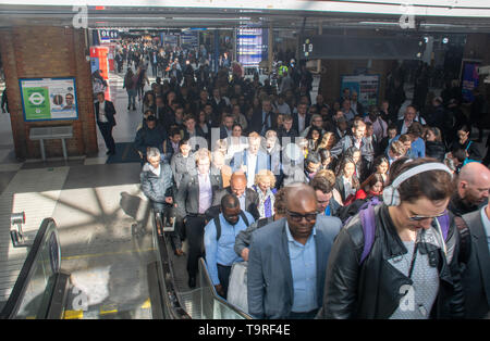 London Liverpool Street United Kingdom  -13 May 2019: Crowd of commuters queuing to leave rail Terminal via stairs Stock Photo