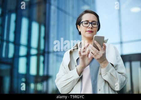 Busy woman checking email Stock Photo