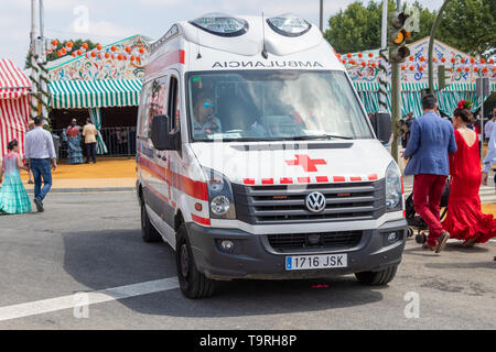 Seville, Spain - May 5, 2019: Red cross medical ambulance during the April Fair of Seville on May, 5, 2019 in Seville, Spain Stock Photo