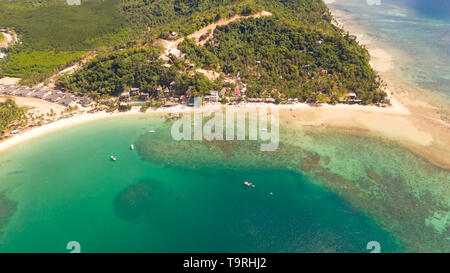 Las Cabanas Beach. Islands and beaches of El Nido.Tropical islands with white sandy beaches, aerial view. Stock Photo