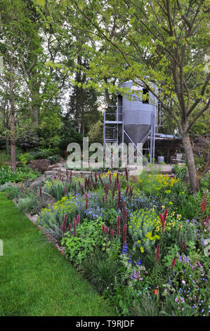 The Resilience Garden (designed by Sarah Eberle), one of the eleven beautiful and elegant show gardens on display at the 2019 RHS Chelsea Flower Show which opened today in the 11-acre grounds of the Royal Hospital Chelsea, London, United Kingdom - 20 May 2019  This garden celebrates the Forestry Commission’s centenary year while also looking ahead to the biggest challenges facing forests of the future, exploring how they can be made resilient to a changing climate and the increasing threats of pests and diseases.  There are 26 themed gardens on display at this year’s show as well as over 100 p Stock Photo