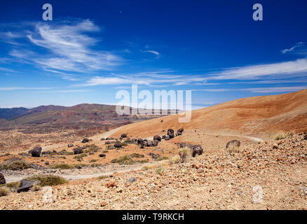 Tenerife, view from hiking path to the summit towards dark lava bombs called Huevos del Teide, Eggs of Teide Stock Photo