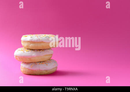 Tasty doughnuts on color background Stock Photo