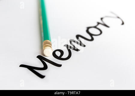 A pencil with an eraser and the word 'memory' with a blurry ending. The concept of memory problems, oblivion. Stock Photo