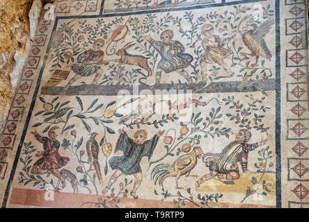 Cubicolo dei fanciulli cacciatori mosaic hunting scenes children killing hare Villa Romana del Casale Piazza Armerina Sicily. Stock Photo
