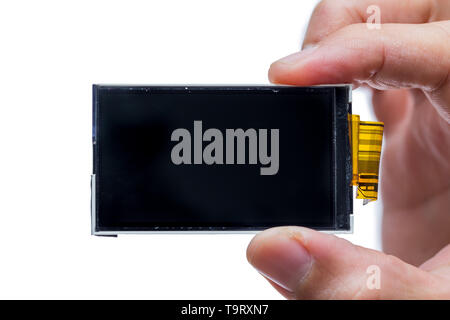 lcd screen digital display device electornic part disassembled on hand isolated on white Stock Photo