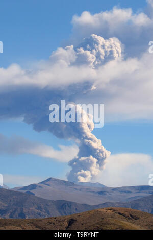 Sabancaya Volcano in the Andes Mountains, column of smoke and ash as it erupts in July 2017 Stock Photo