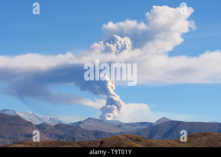 Sabancaya Volcano in the Andes Mountains, column of smoke and ash as it erupts in July 2017 Stock Photo