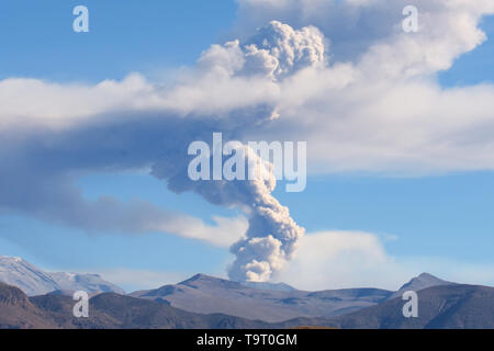 Sabancaya Volcano in the Andes Mountains, column of smoke and ash as it erupts in July 2017 Stock Photo