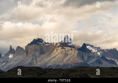 Clouds over the Cuernos or Horns in Torres del Paine National Park, a UNESCO World Biosphere Reserve in Chile in the Patagonia region of South America Stock Photo