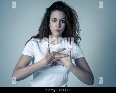 Young woman with red hair confused and displeased staring in disgust. Looking puzzled not understanding or liking something. Portrait with copy space. Stock Photo