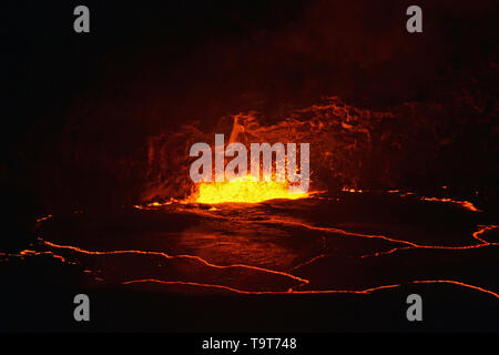 Active lava exploding inside the Halemaumau Crater at night, Kilauea Volcano, Volcanoes National Park, Big Island, Hawaii, USA Stock Photo