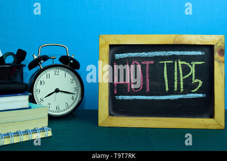 Hot Tips Planning on Background of Working Table with Office Supplies. Business Concept Planning on Blue Background Stock Photo