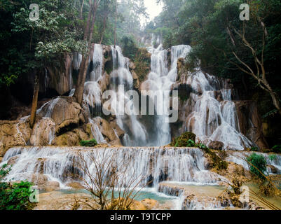 Jangle landscape with amazing turquoise water of Kuang Si cascade waterfall at deep tropical rain forest. Luang Prabang, Laos travel landscape and des Stock Photo