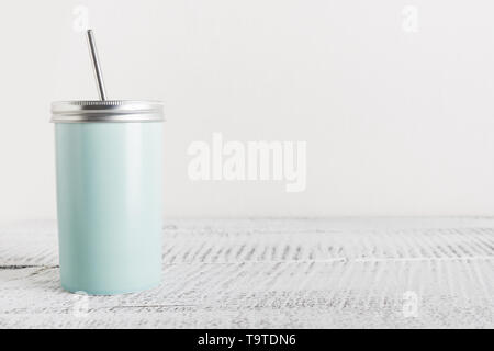 Reusable blue jar with metal straw for summer drinks. Individual use. Save the planet. Zero waste concept. Plastic free. Stock Photo