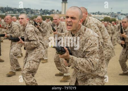 U.S. Marine recruits with Bravo Company, 1st Recruit Training Battalion, practice bayonet techniques during the Bayonet Assault Course at Marine Corps Recruit Depot San Diego May 15, 2019 in San Diego, California. Stock Photo