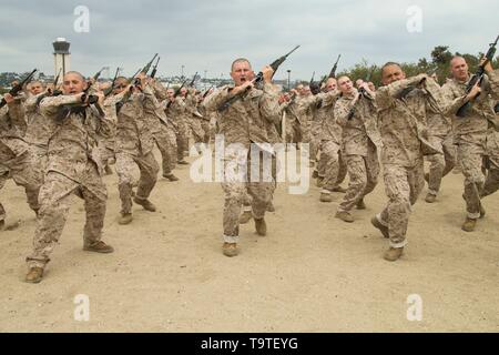 U.S. Marine recruits with Bravo Company, 1st Recruit Training Battalion, practice bayonet techniques during the Bayonet Assault Course at Marine Corps Recruit Depot San Diego May 15, 2019 in San Diego, California. Stock Photo