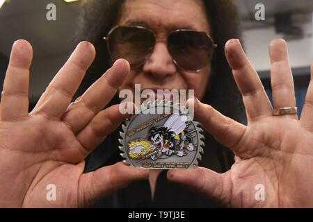 Rock legend Gene Simmons of KISS shows a custom-made coin presented to him during a meet-and-greet at the Pentagon May 16, 2019 in Washington, D.C. Stock Photo