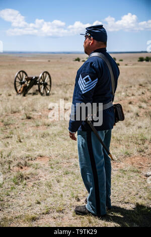 Civil War Era Union Sergeant (reenactor), 1st New Mexico Volunteers, 3rd Regiment, and cannon, Fort Union National Monument, New Mexico USA Stock Photo