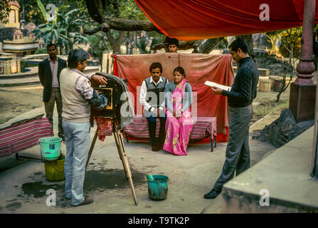 young married posing for the souvenir photo. Analogue photography Stock Photo