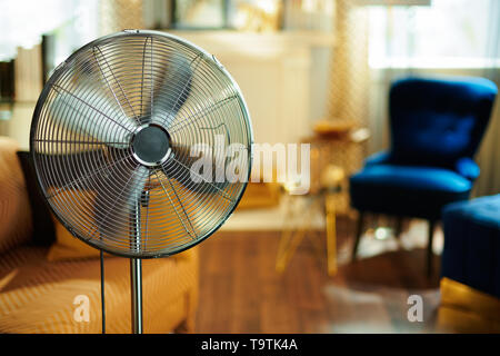 Closeup On Working Electric Floor Standing Fan In The Modern House