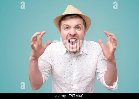 Furious,enraged man with mouth opened in shout Stock Photo