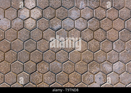 Hexagonal concrete pavement tiles background from above Stock Photo