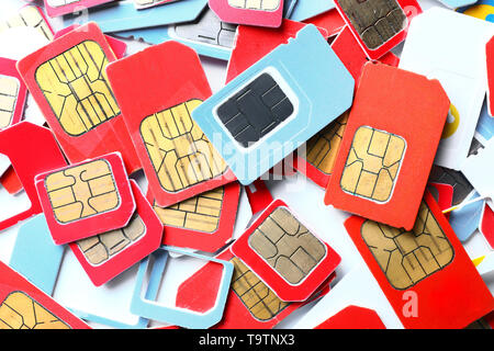 Many sim cards on white background Stock Photo