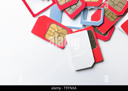 Many sim cards on white background Stock Photo
