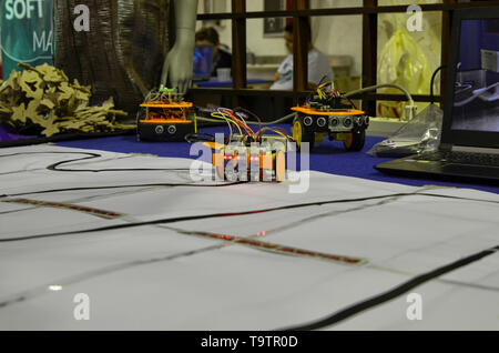Turin, Piedmont, Italy. June 3 2018. At the Fablab of Turin a demo with a small robot equipped with sensors that allow him to follow a line, making hi Stock Photo