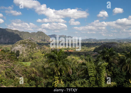 Clouds and blue sky over the tobacco fields and farms of Vinales Valley, Cuba Stock Photo