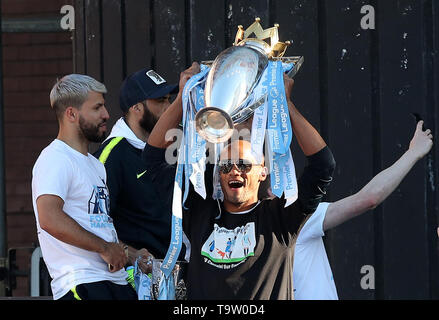 Manchester City's Vincent Kompany lifts the Premier League trophy during the trophy parade in Manchester. Stock Photo