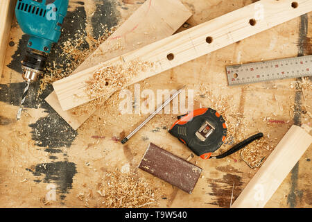 Top view background of tools and wood lying on table in carpenters workshop, copy space Stock Photo