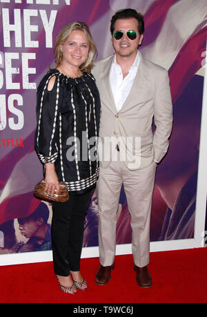 New York, NY, USA. 20th May, 2019. Justine Maurer and John Leguizamo at the Netflix world premiere of When They See Us at The Apollo Theatre in New York City on May 20, 2019. Credit: Diego Corredor/Media Punch/Alamy Live News Stock Photo
